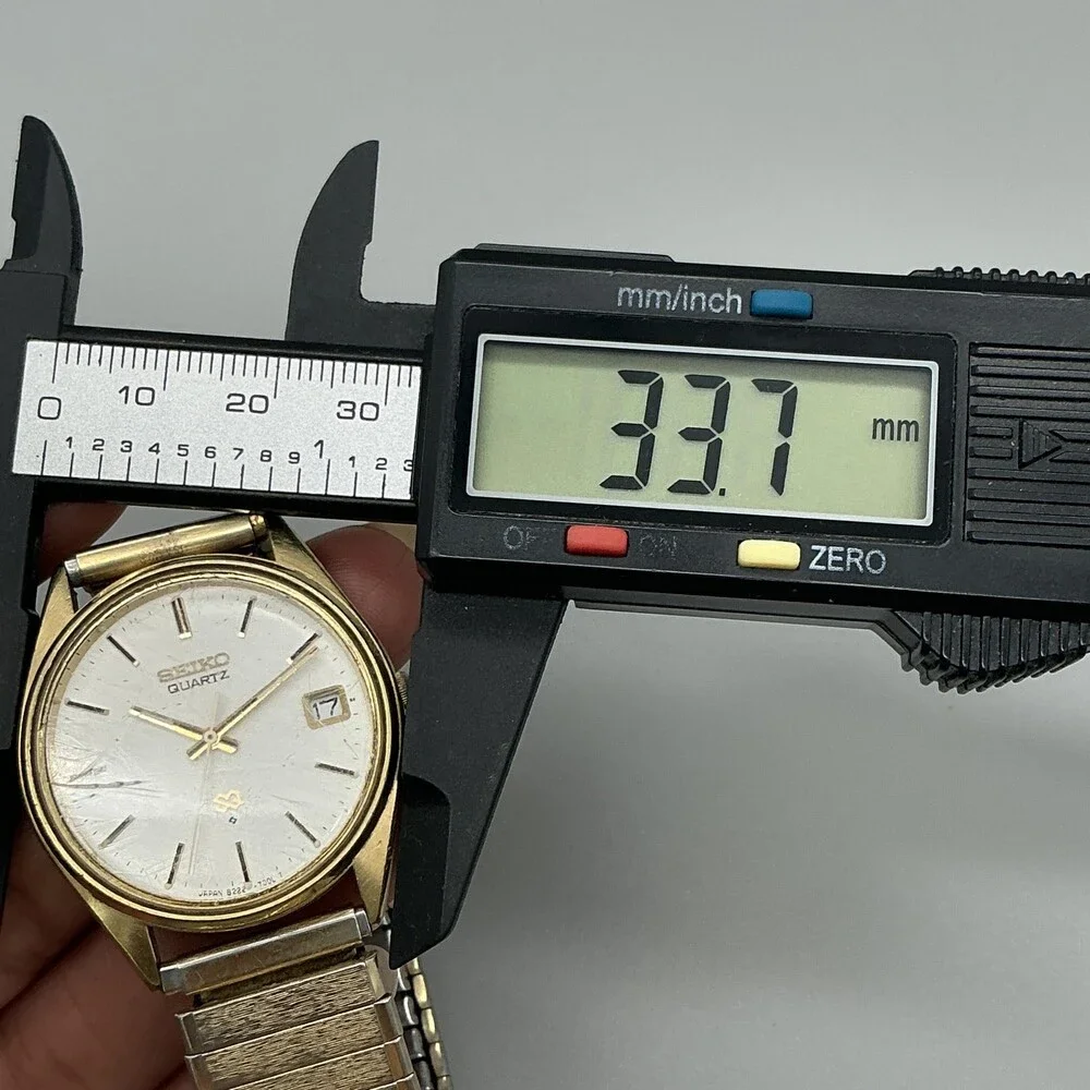 Vintage Seiko Mens Watch 34mm Gold Tone Stretch Band Date 8222-7009 New Battery